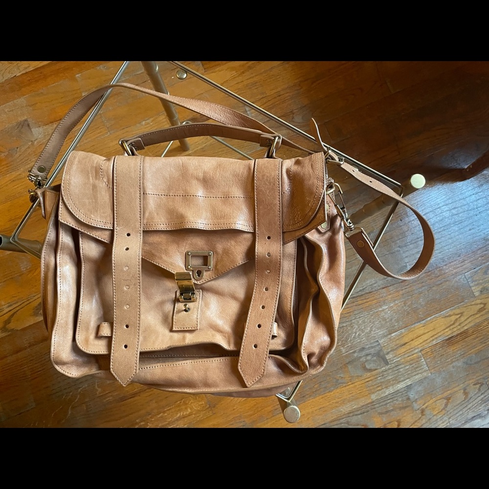 PS1 bag- used, blush colored, two pen marks in the back of the bag.